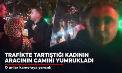 Trafikte tartıştığı kadın sürücünün aracının camını yumrukladı